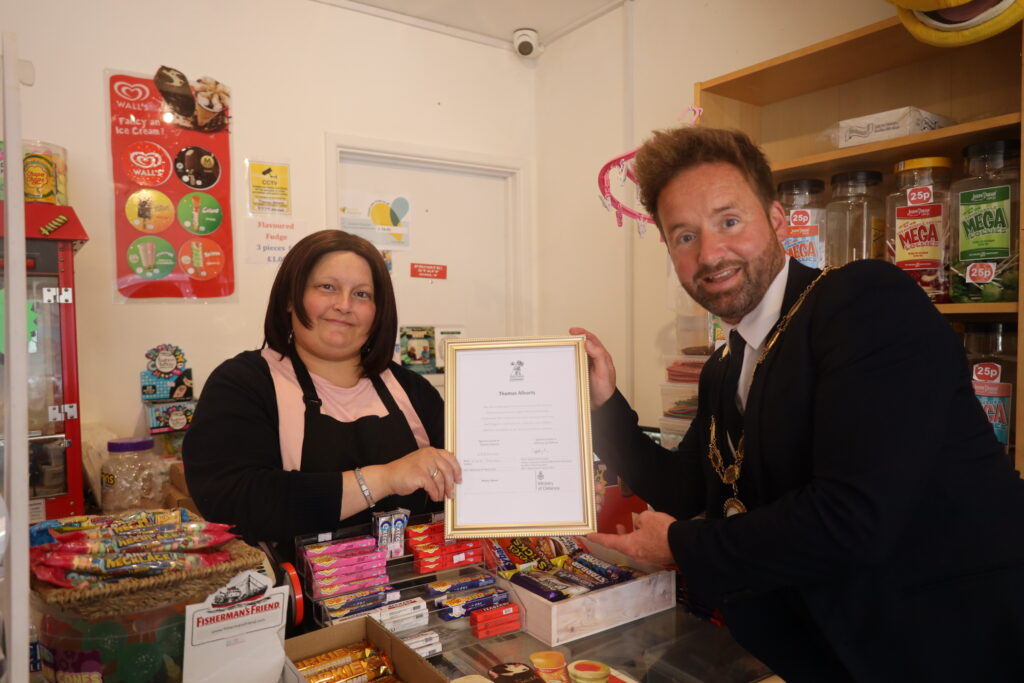Thomas Allsorts receiving their Armed Forces Covenant certificate by Cllr Ian Preece, Mayor of Great Dawley