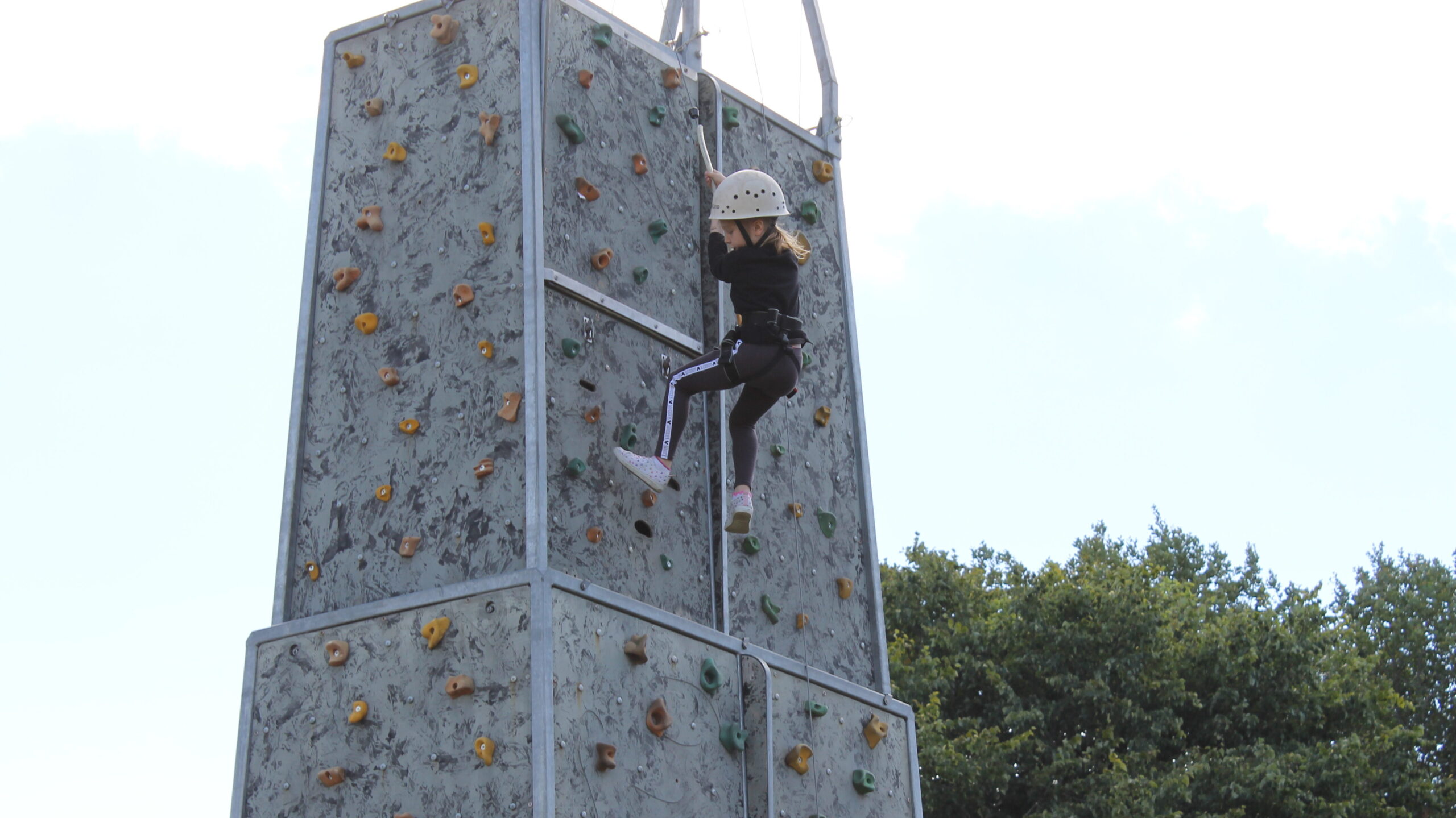 Children enjoying the climbing wall.