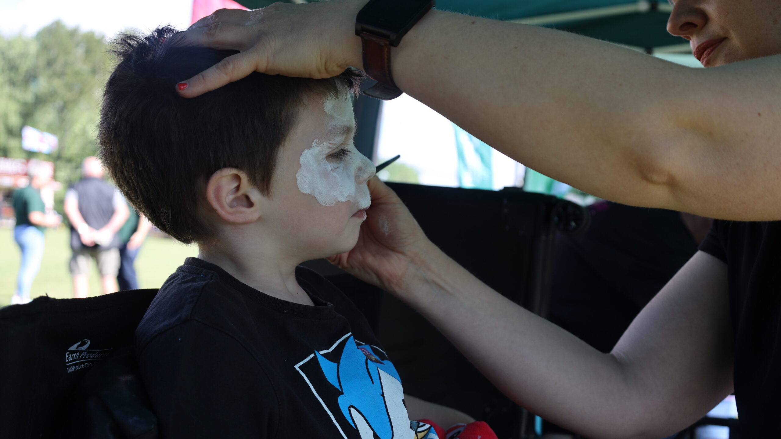 A child getting their face painted