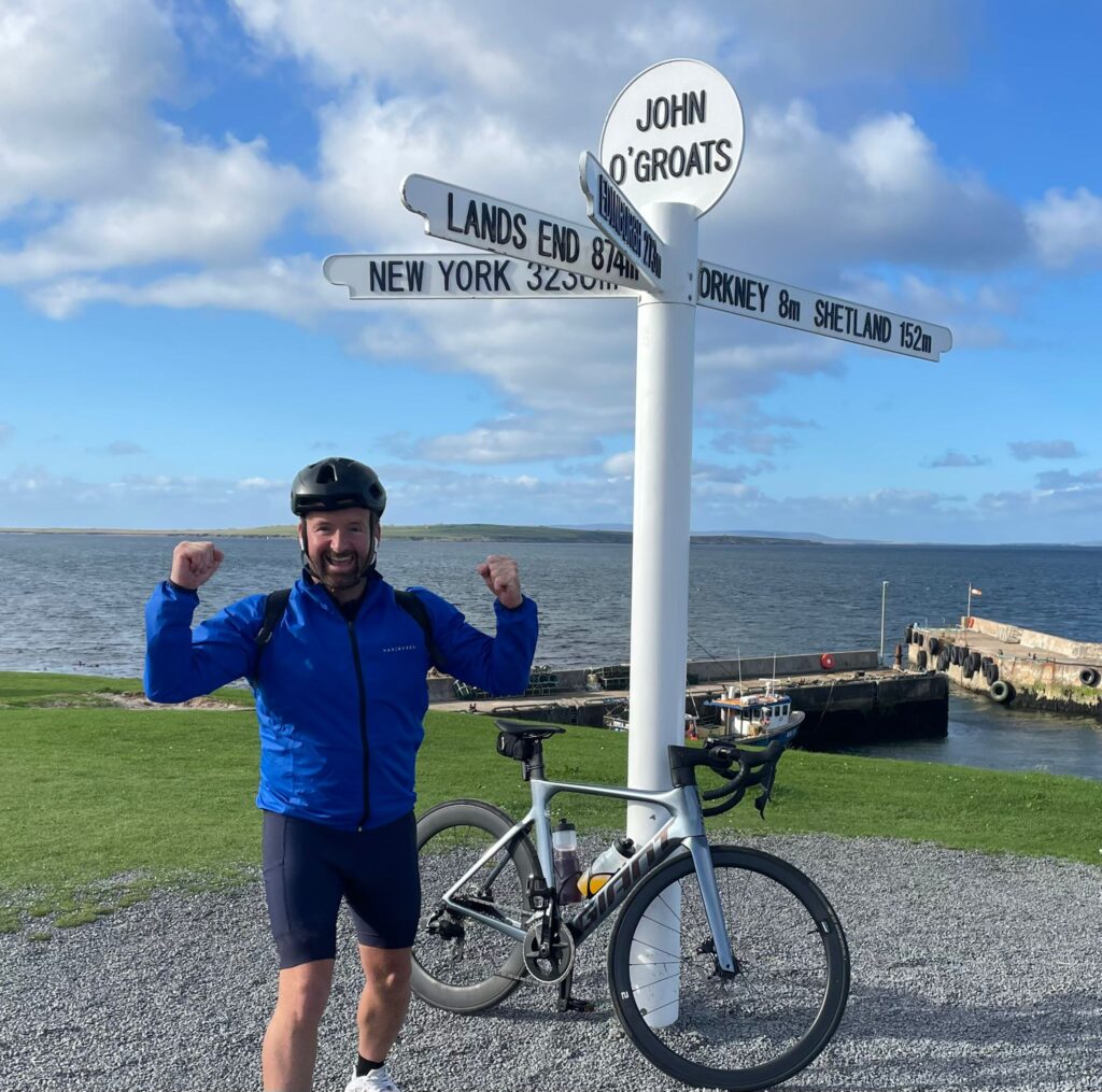 Cllr Ian Preece, at the John O'Groat's Signpost