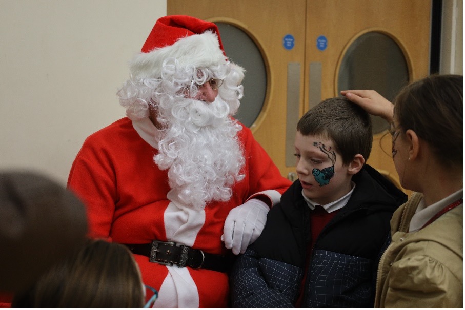 Santa speaking to children at last years Malinslee Christmas Lights Switch-on