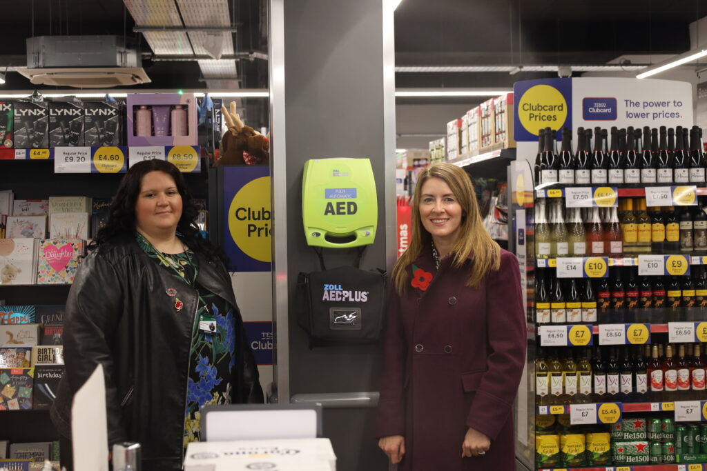 Town Cllr Corrine Chikandamina with Borough Cllr Elise Davies next to a new Defibrillator located in the store