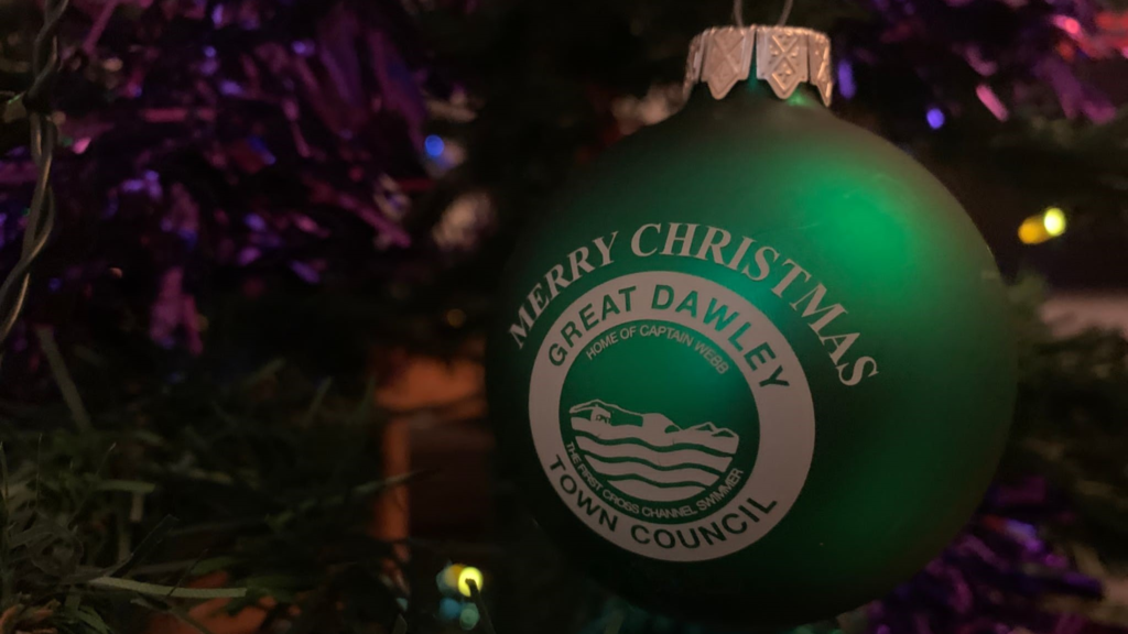 A green metallic painted bauble with the logo of Great Dawley Town Council printed on it